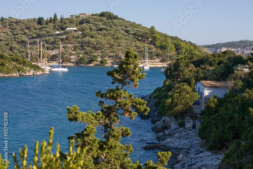 The beautiful bay of Moggonissi, at the southern tip of Paxos, Greece, with a small fleet of moored yachts anchored in the sheltered harbour