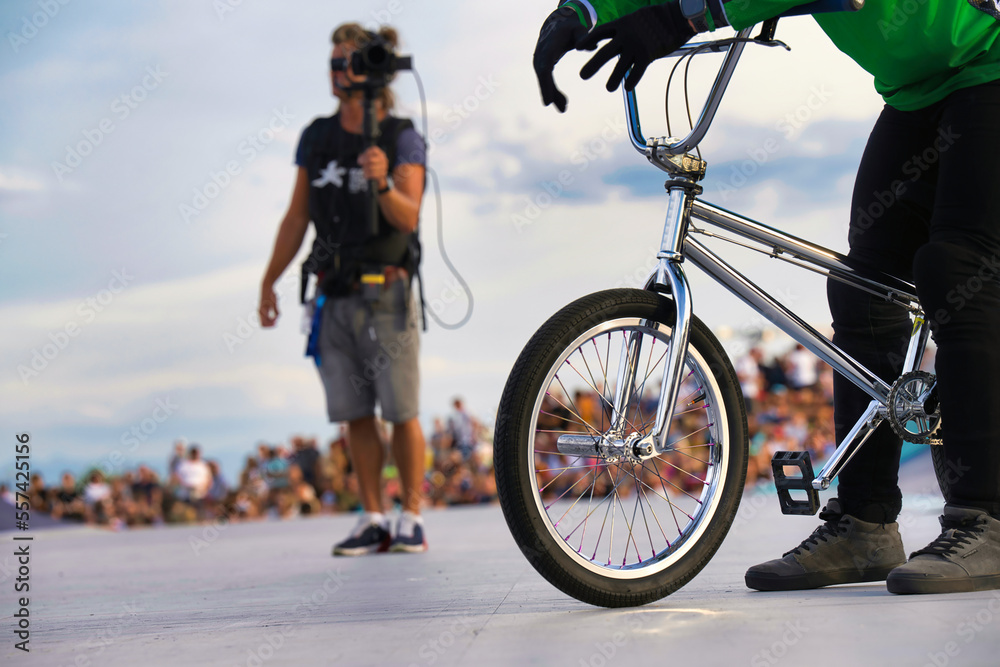 Obraz premium person riding a bicycle space, exhilaration, park, racey, motion, adventure, ramp high, flight, black, concrete, fly, pursuit, culture, flying, recreational fast