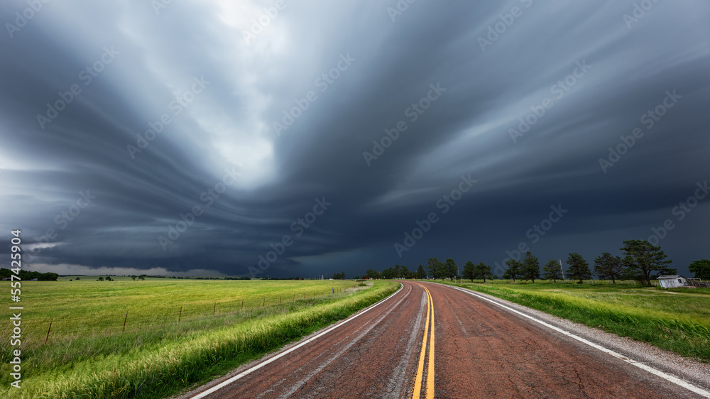 Road leading to a supercell storm