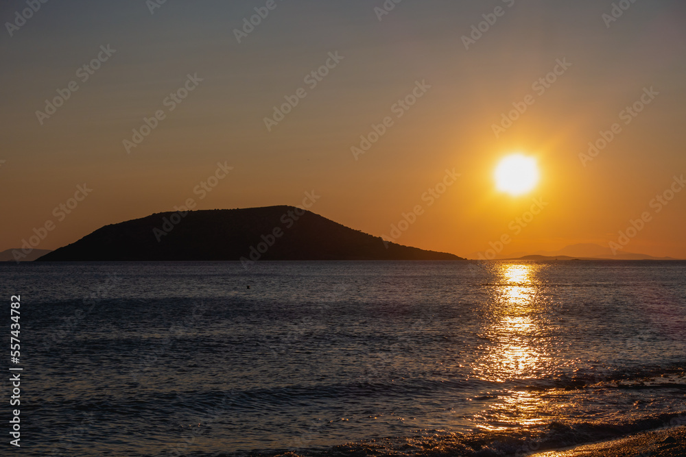 Sunset over Greek islands and Mediterranean Sea in summer evening