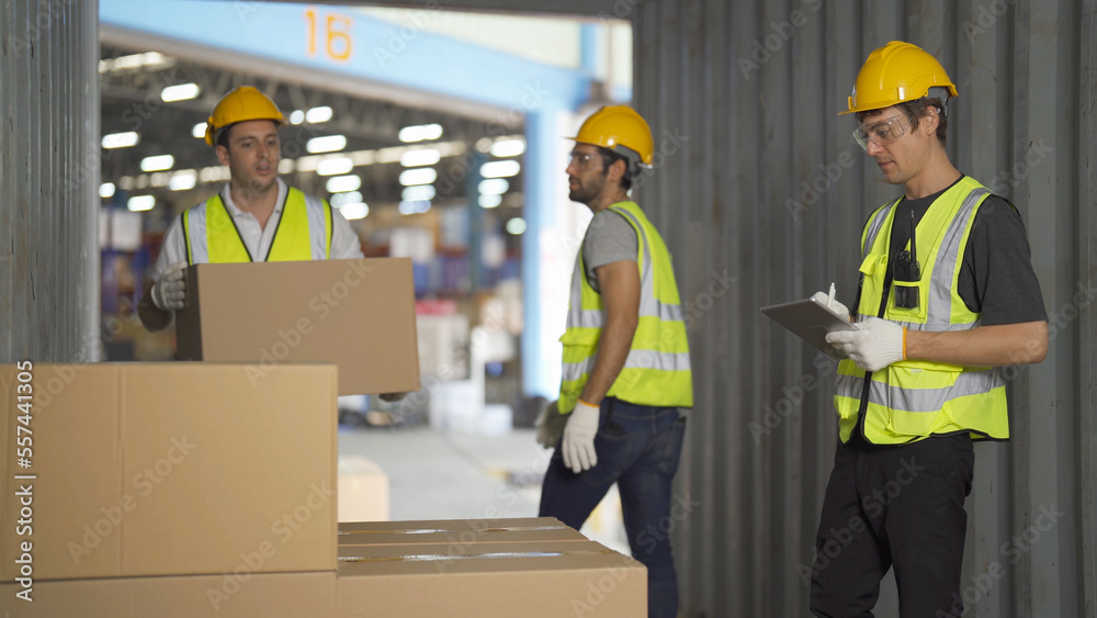 Teamwork of workers working in large warehouse retail store industry.Rack of stock storage. Interior of cargo in ecommerce and logistic concept. Depot. People lifestyle. Shipment service for container Teamwork of workers working in large warehouse retail store industry.Rack of stock storage. Interior of cargo in ecommerce and logistic concept. Depot. People lifestyle. Shipment service for container