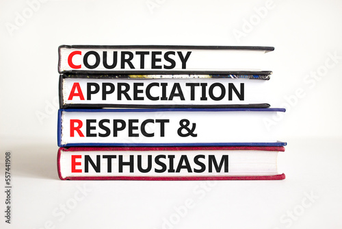 CARE symbol. Concept words CARE courtesy appreciation respect and enthusiasm on books on beautiful white background. Business CARE courtesy appreciation respect enthusiasm concept. Copy space.