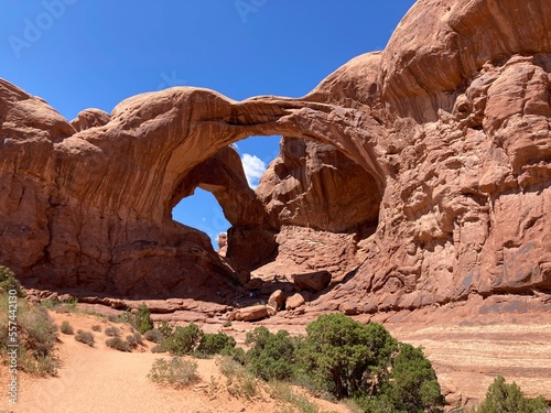 Double Arch, an incredible formation of arches within the Windows area of Arches National Park. Summer view with deep blue sky 