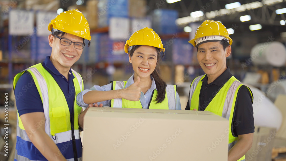 Teamwork of Asian workers working in large warehouse store industry.Rack of stock storage. Interior of cargo in ecommerce and logistic concept. Depot. People lifestyle. Shipment service for container Teamwork of Asian workers working in large warehouse store industry.Rack of stock storage. Interior of cargo in ecommerce and logistic concept. Depot. People lifestyle. Shipment service for container