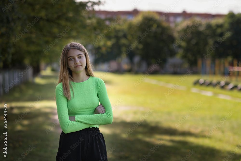 Portrait of a young beautiful fair-haired girl in a summer park. Portrait of a young beautiful fair-haired girl in a summer park.