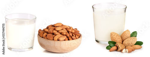 Almond milk in a glass and almonds in a wooden bowl isolated on a white background