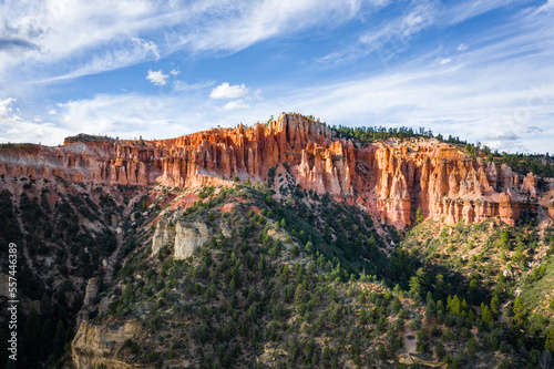 orange sandstone mountain and green forest at bryce canyon