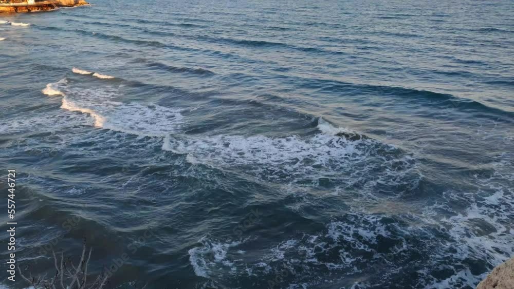 Mediterranean Sea. Waves roll on the sandy shore. View from above.