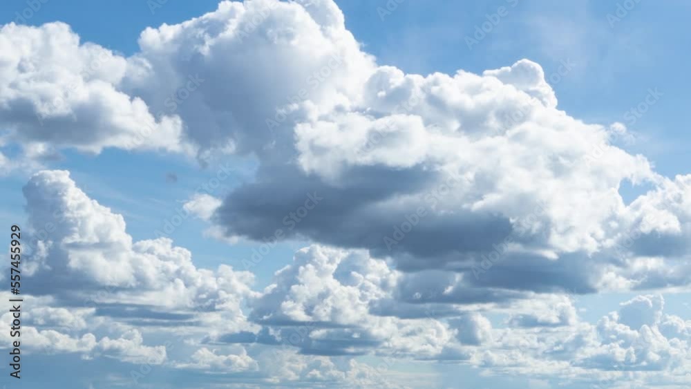 Blue sky white clouds. The rays of the sun penetrate the clouds. Summer clear sky. Lovely background Blue sky white clouds. The rays of the sun penetrate the clouds. Summer clear sky. Lovely background