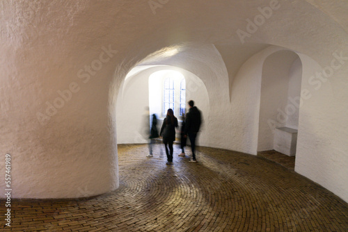 Tourists walk around The Round Tower (Rundetaarn) in Copenhagen, Denmark 