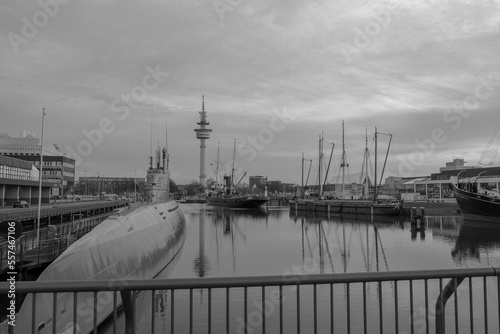 Sunset in Bremerhaven with houses and ships and the (bremer Schiffahrts-Museum), Klimahaus and the coast line of Bremerhaven (technik museum) taken from 90 m high bulding, Monochrom, sepia, panorama 