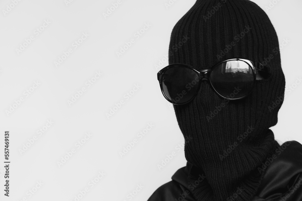 Hat balaclava on a girl and sunglasses on a white background, the face of a thief in a hat with a slit for verbs, a hacker Hat balaclava on a girl and sunglasses on a white background, the face of a thief in a hat with a slit for verbs, a hacker