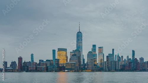 Downtown Manhattan skyline at dusk, New York city, timelapse of day to night transition, panning effect