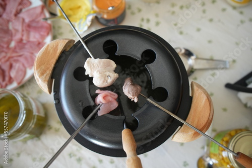 Cooking meat in the pan, fondue Chinoise 