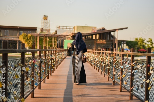 muslim model walking on the Padlock bridge