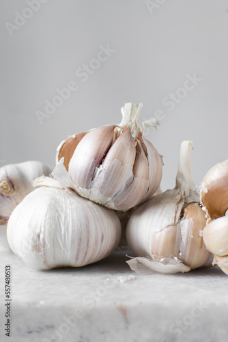 Garlic bulbs on a marble tray, garlic, raw garlic, Allium sativum