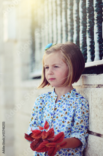 Portrait of little girl outeside photo