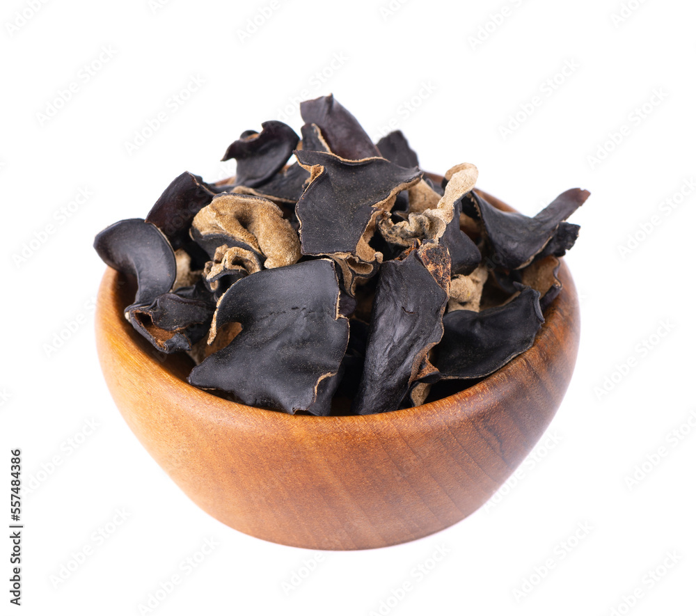 Dry black fungus in wooden bowl, isolated on white background. Chinese ...