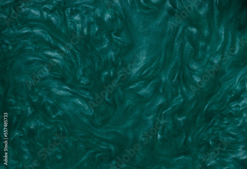 Abstract background of turquoise chaotically mixing rheoscopic liquid