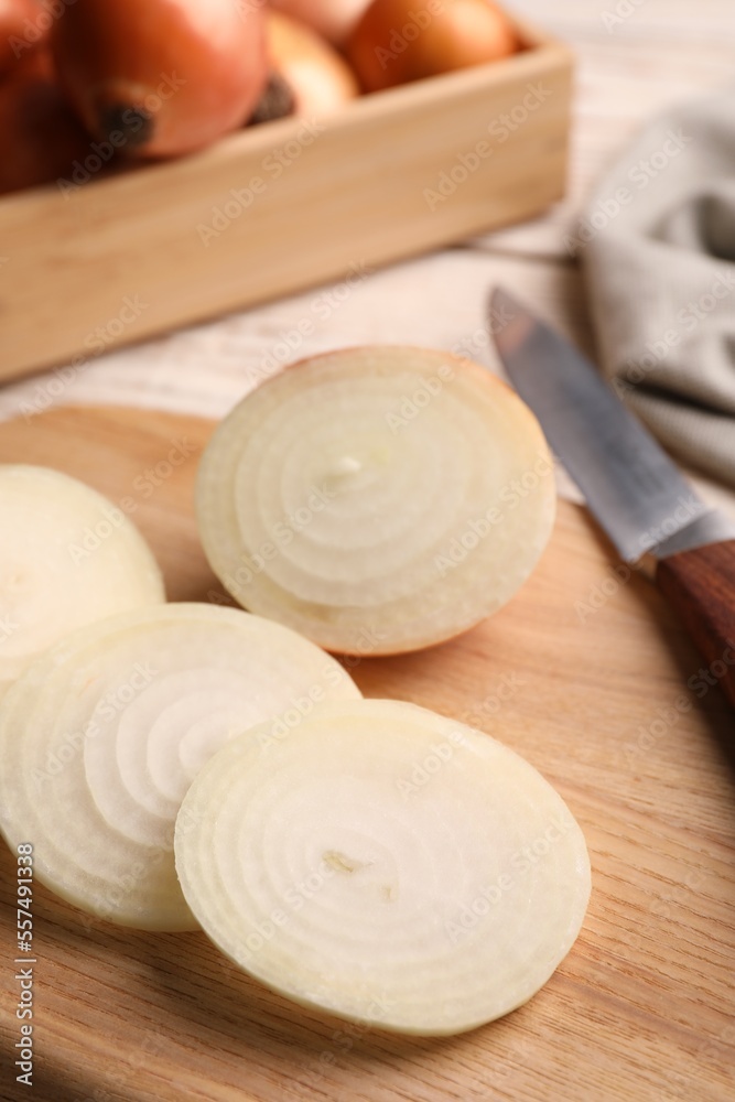 Sliced fresh onion on wooden table, closeup Sliced fresh onion on wooden table, closeup