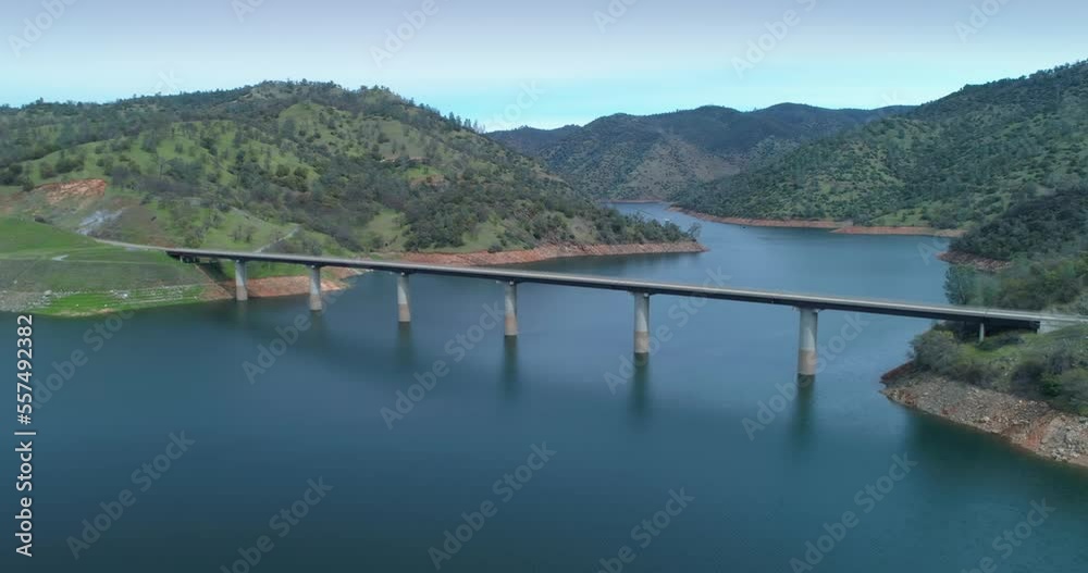 Aerial: Flying Over Don Pedro Reservoir Lake and highway. California, USA Aerial: Flying Over Don Pedro Reservoir Lake and highway. California, USA