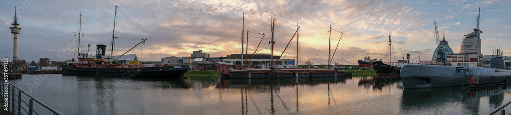 Sunset in Bremerhaven with houses and ships and the (bremer Schiffahrts-Museum), Klimahaus and the coast line of Bremerhaven (technik museum) taken from 90 m high bulding, Monochrom, sepia, panorama 