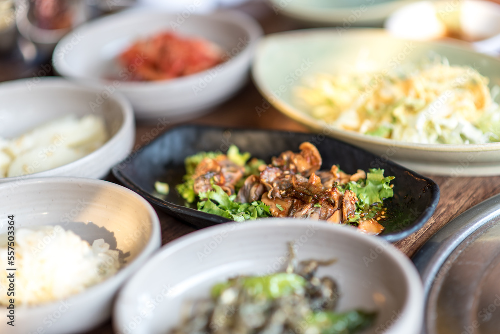 Assortment of Korean food in a Korean traditional restaurant. Seashell with spicy saurce and vegetables. Assortment of Korean food in a Korean traditional restaurant. Seashell with spicy saurce and vegetables.