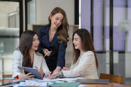 Young business team working with business report document on office desk. Brainstorming Business People Design Planning, Brainstorming Planning Partnership. © Songsak C