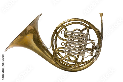A vintage French horn on a white background