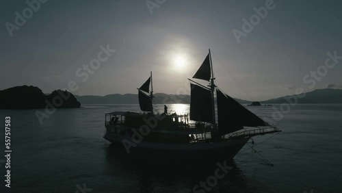 Aerial top view of a traditional boat in beautiful sea bay with turquoise crystal clear water, 