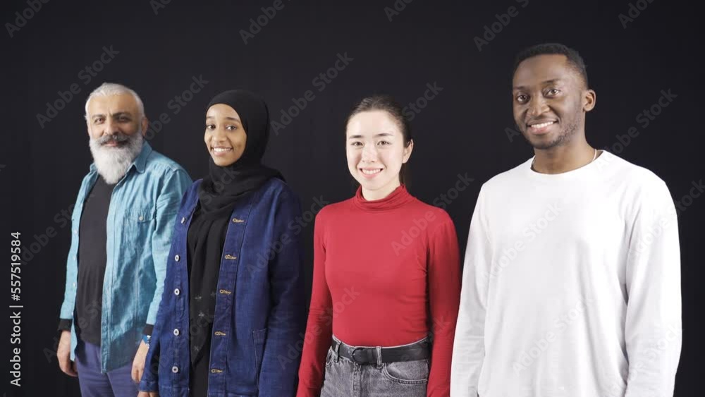 Group of people of different races looking at camera on black ...