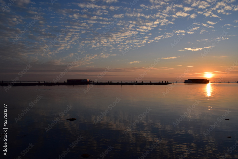 Naklejka premium sunset over the river