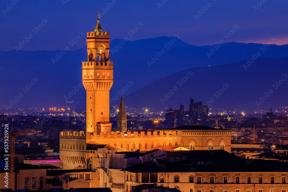 Sunset view of the Palazzo Vecchio Tower and Florence cityscape, at night, Italy