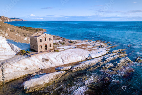 Fototapeta Naklejka Na Ścianę i Meble -  Punta Bianca, Agrigento in Sicily Italy White beach with old ruins of an abandoned stone house on white cliffs. Sicilia Italy