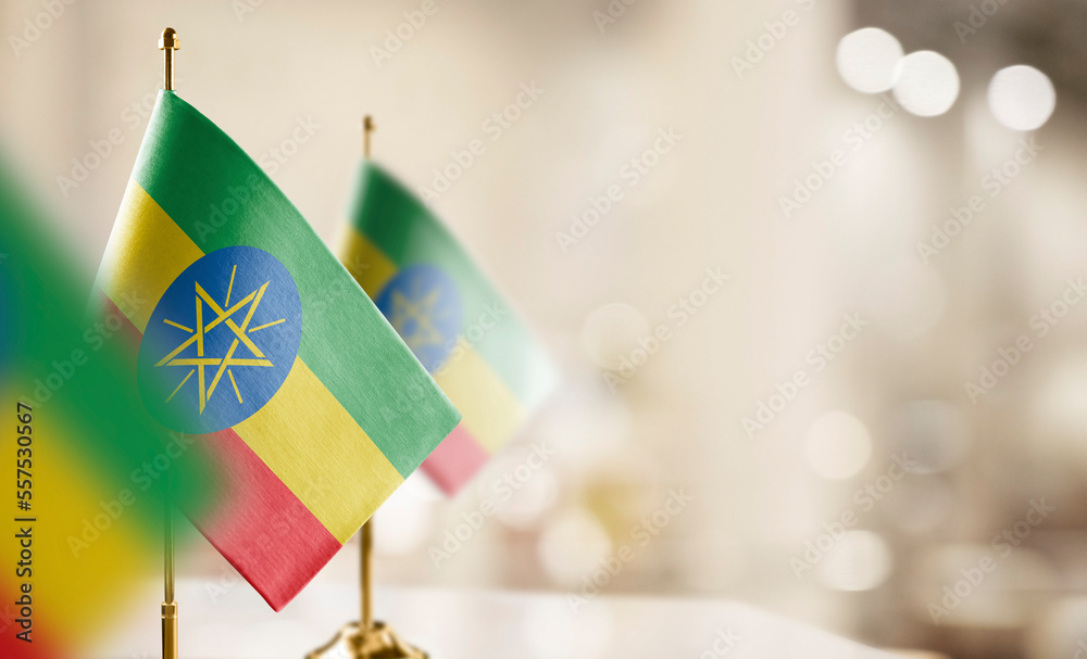 Small flags of the Ethiopia on an abstract blurry background