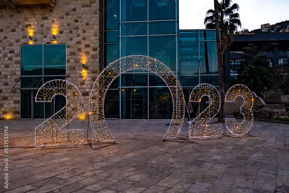 Fototapeta premium Glowing installation with the inscription 2023