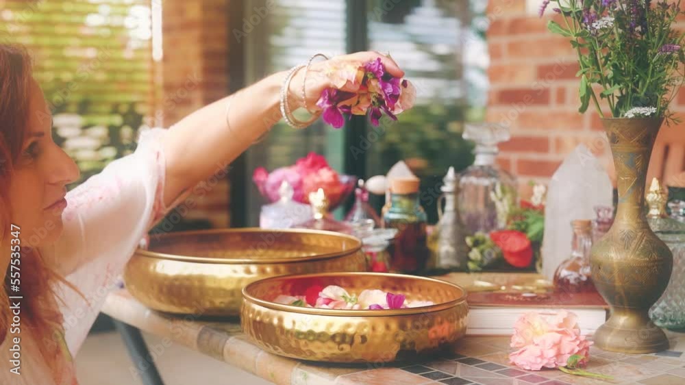 flower for the preparation of essential oil. Spa and aromatherapy. Pouring flowers into the cape.