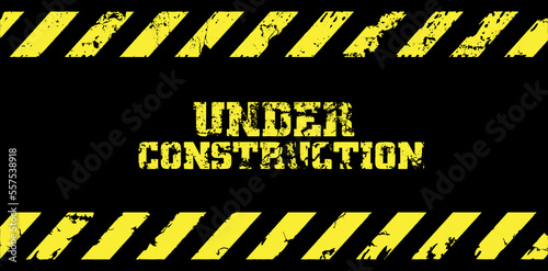 under construction text and brick background