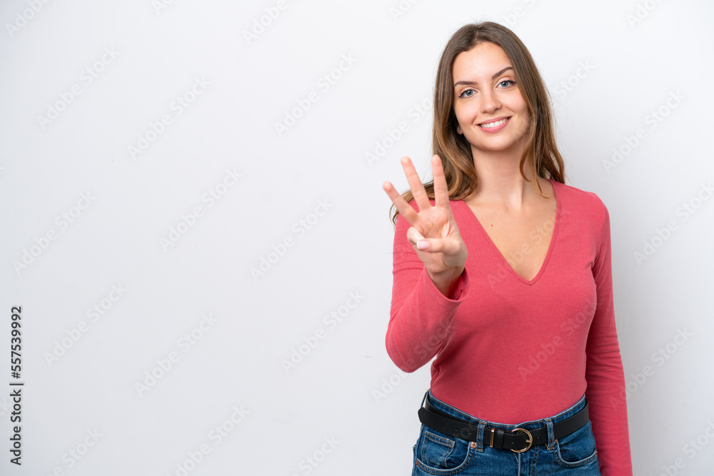 Young caucasian woman isolated on white background happy and counting three with fingers Young caucasian woman isolated on white background happy and counting three with fingers