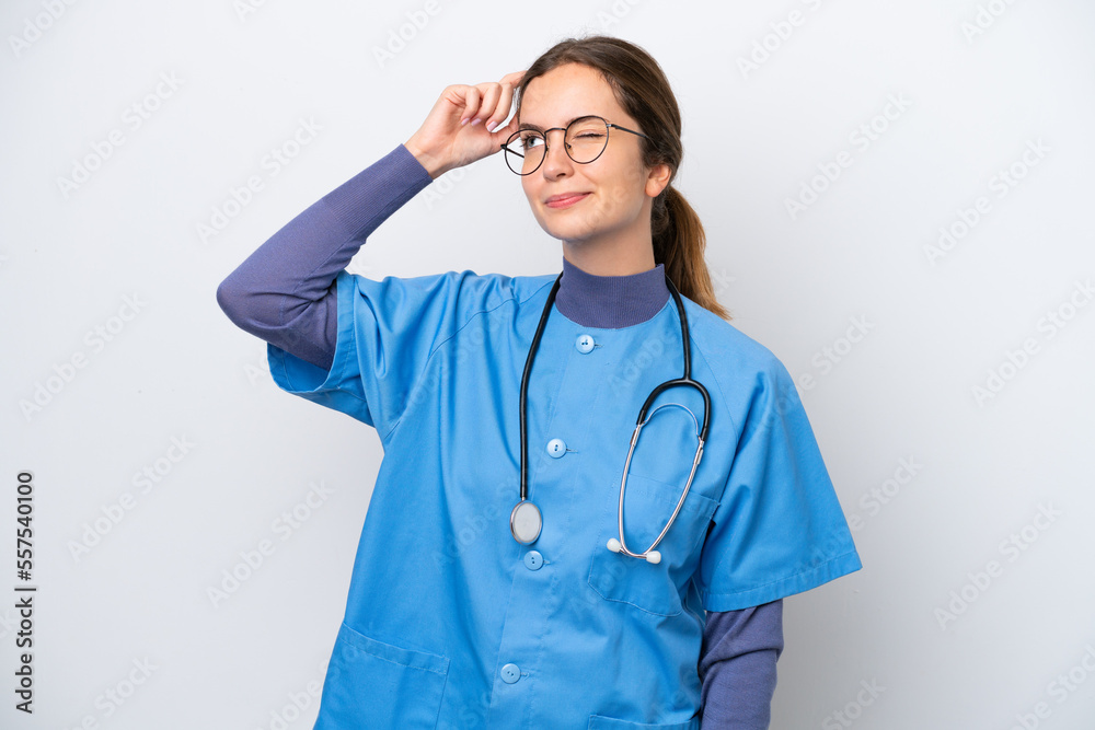 Young caucasian nurse woman isolated on white background having doubts and with confuse face expression Young caucasian nurse woman isolated on white background having doubts and with confuse face expression
