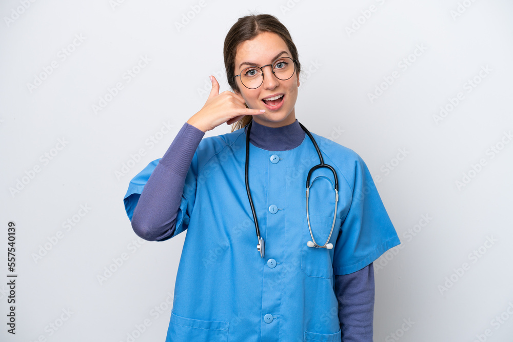 Young caucasian nurse woman isolated on white background making phone gesture. Call me back sign Young caucasian nurse woman isolated on white background making phone gesture. Call me back sign
