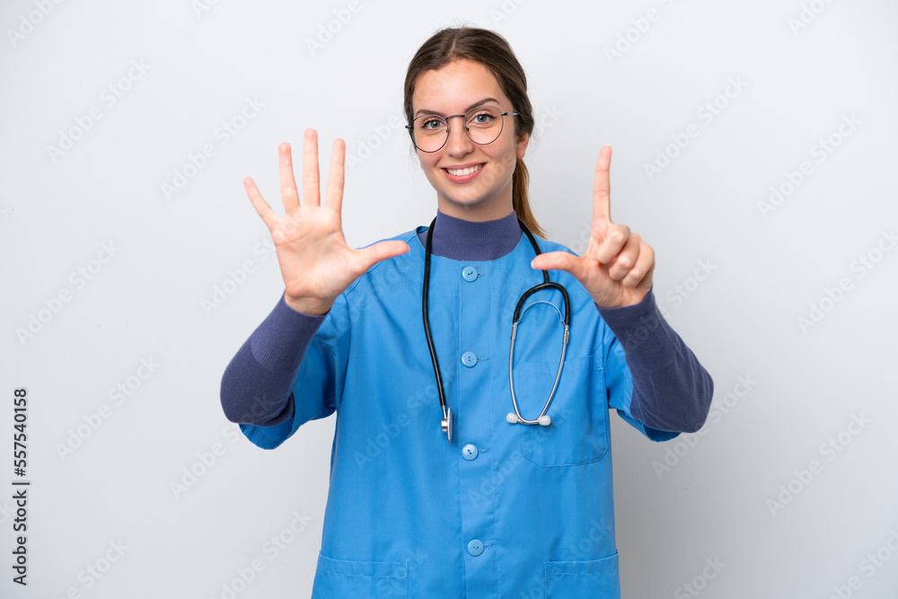 Young caucasian nurse woman isolated on white background counting seven with fingers Young caucasian nurse woman isolated on white background counting seven with fingers