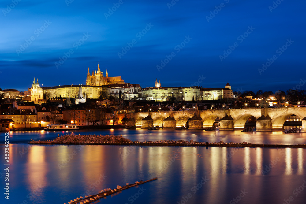 Panorama of Prague Castle,St. Vitus cathedral and Charles Bridge at sunset with dramatic sky. Prague, Czech Republic