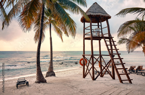Lifeguard tower on a Caribbean beach at sunrise.
