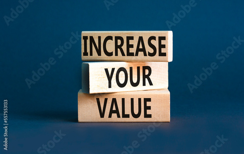 Increase your value symbol. Concept words Increase your value on wooden blocks on a beautiful grey table grey background. Business increase your value concept. Copy space. © Dzmitry