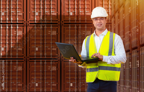 Logistic man with laptop. G...