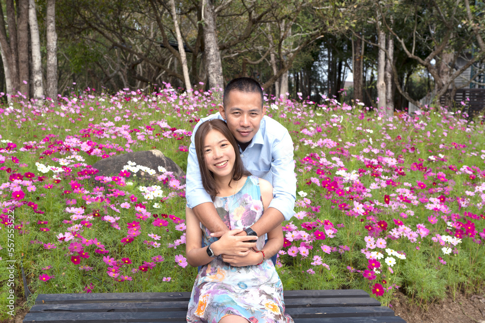 Portrait of a romantic Asian couple embracing each other in a beautiful park in autumn.Valentine's Day. Concept of love Portrait of a romantic Asian couple embracing each other in a beautiful park in autumn.Valentine's Day. Concept of love