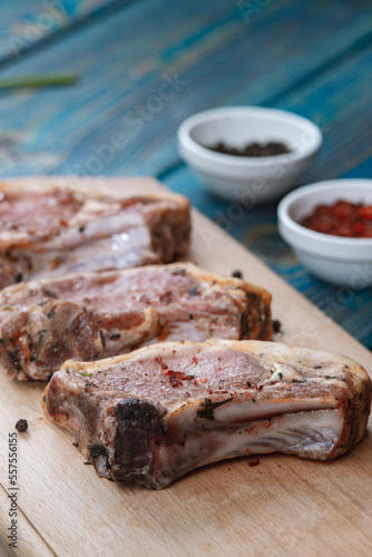 Raw pork meat . Chops on wooden background