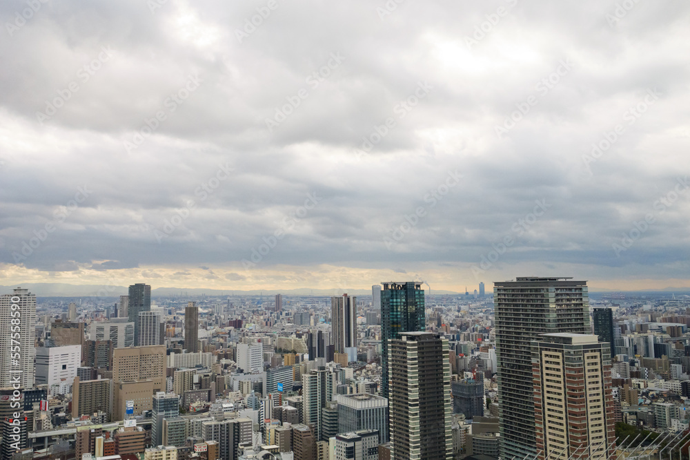 Overhead view of Osaka's Umeda area from a hill on a cloudy day