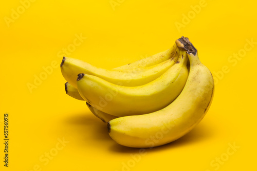 Bunch of bananas on yellow background